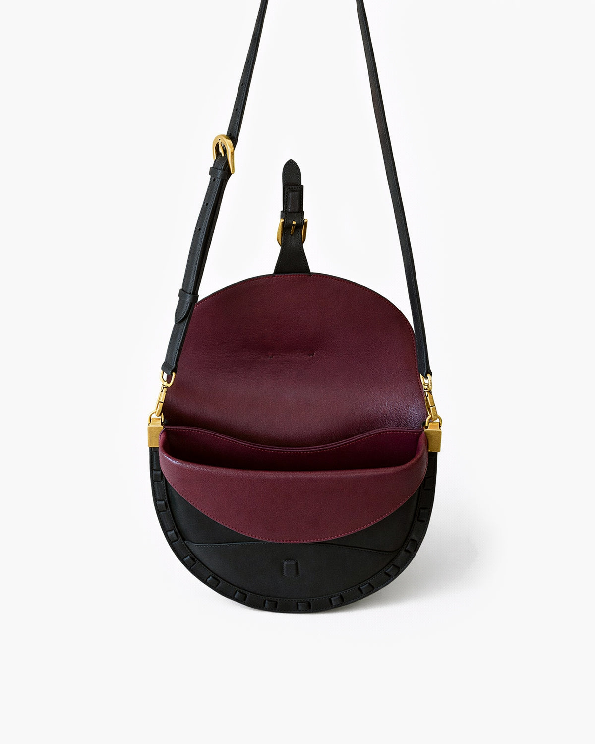 Black and burgundy handbag with gold accents on a white background