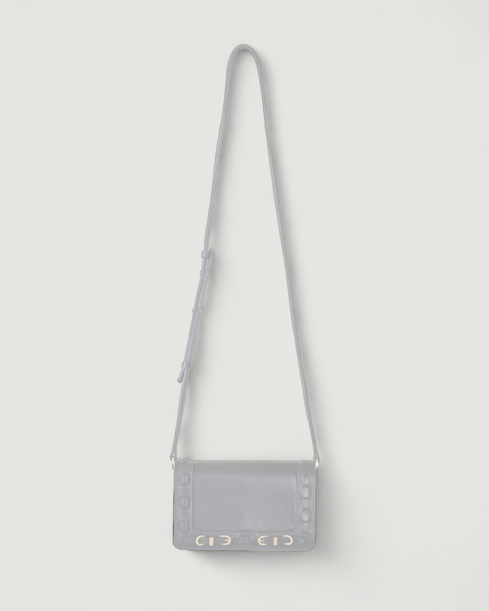 Silhouette of a Black handbag on a light gray background