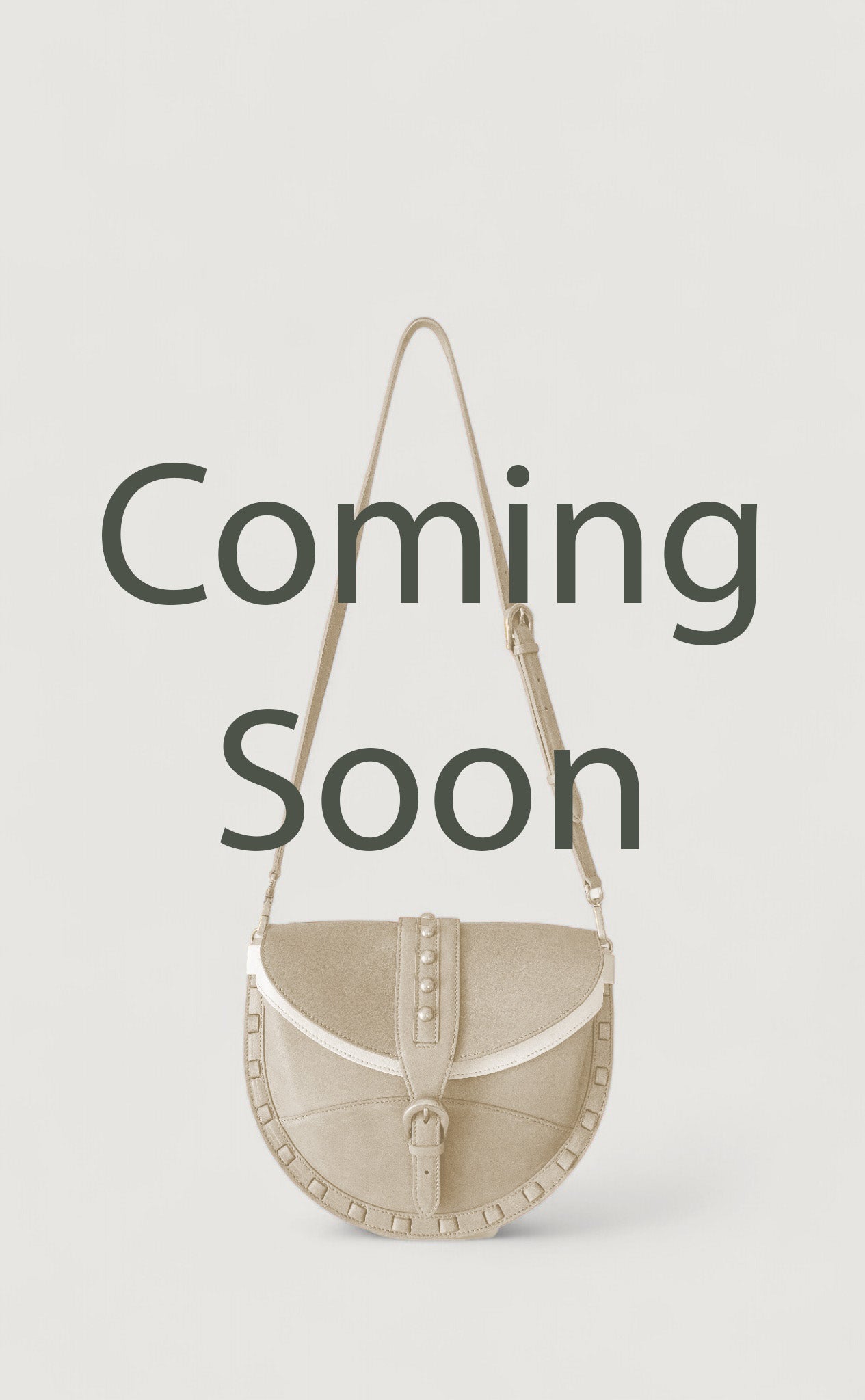 Beige handbag with 'Coming Soon' text on a light gray background