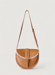 Brown leather handbag with a strap on a light gray background