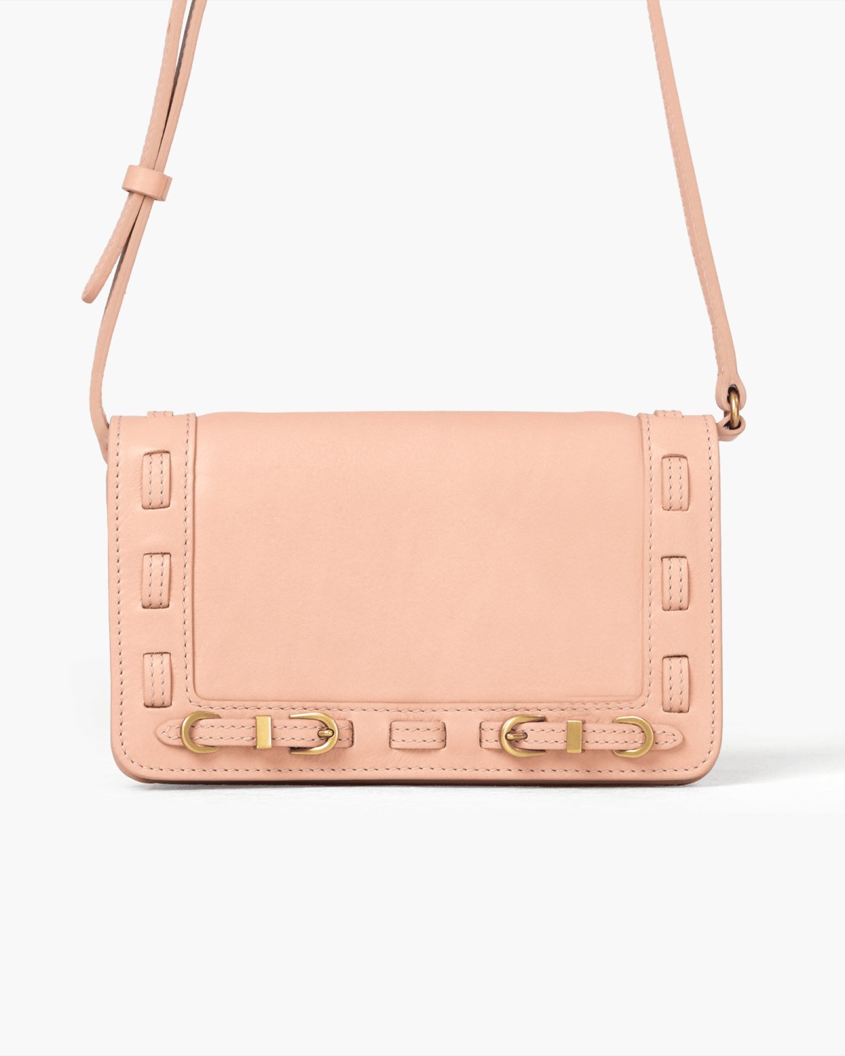 Pink handbag with brass accents on a white background