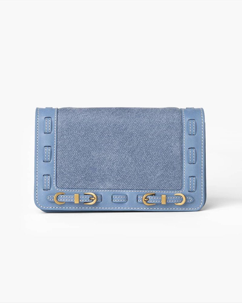 Denim blue handbag with brass hardware