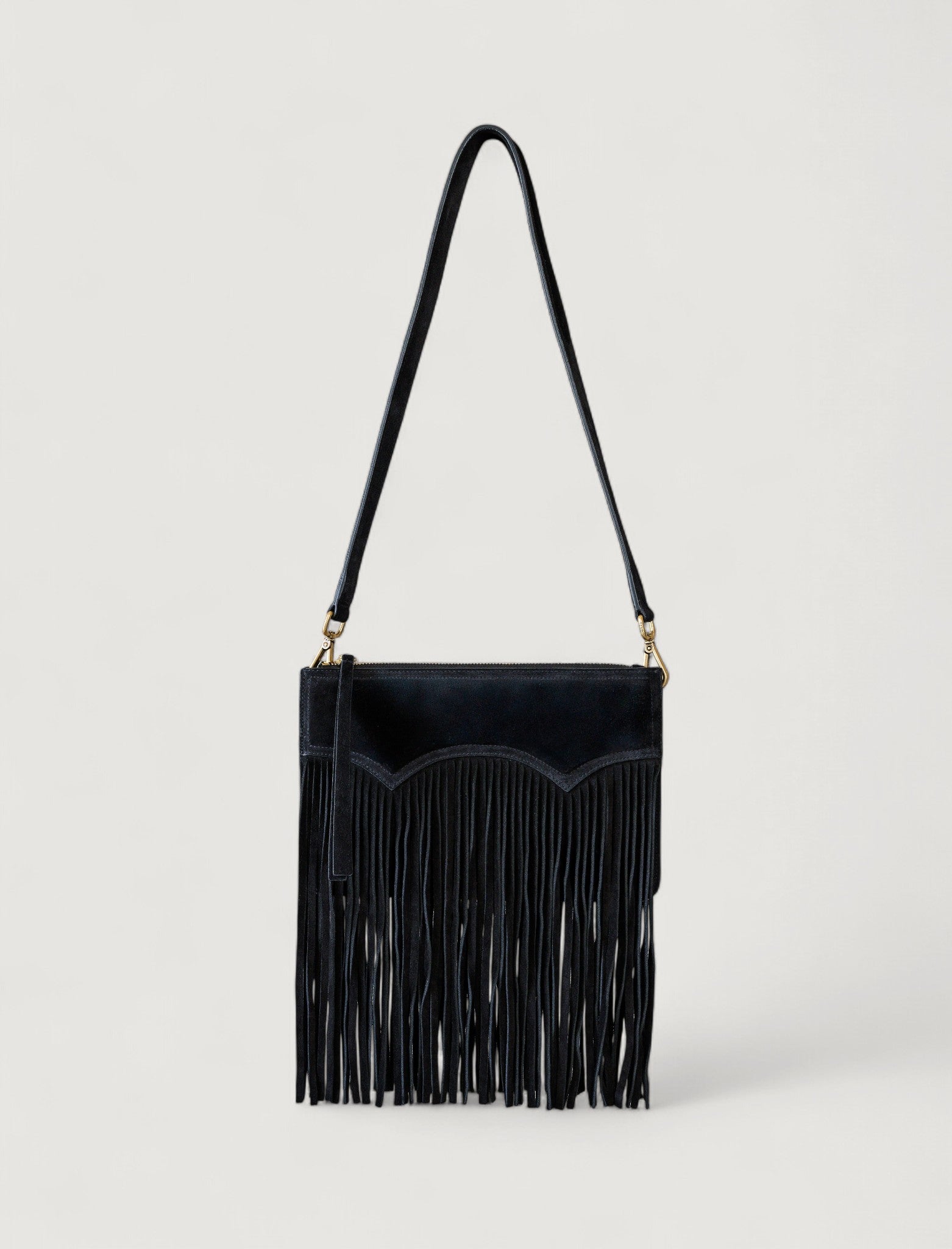 Black fringe handbag on a light gray background