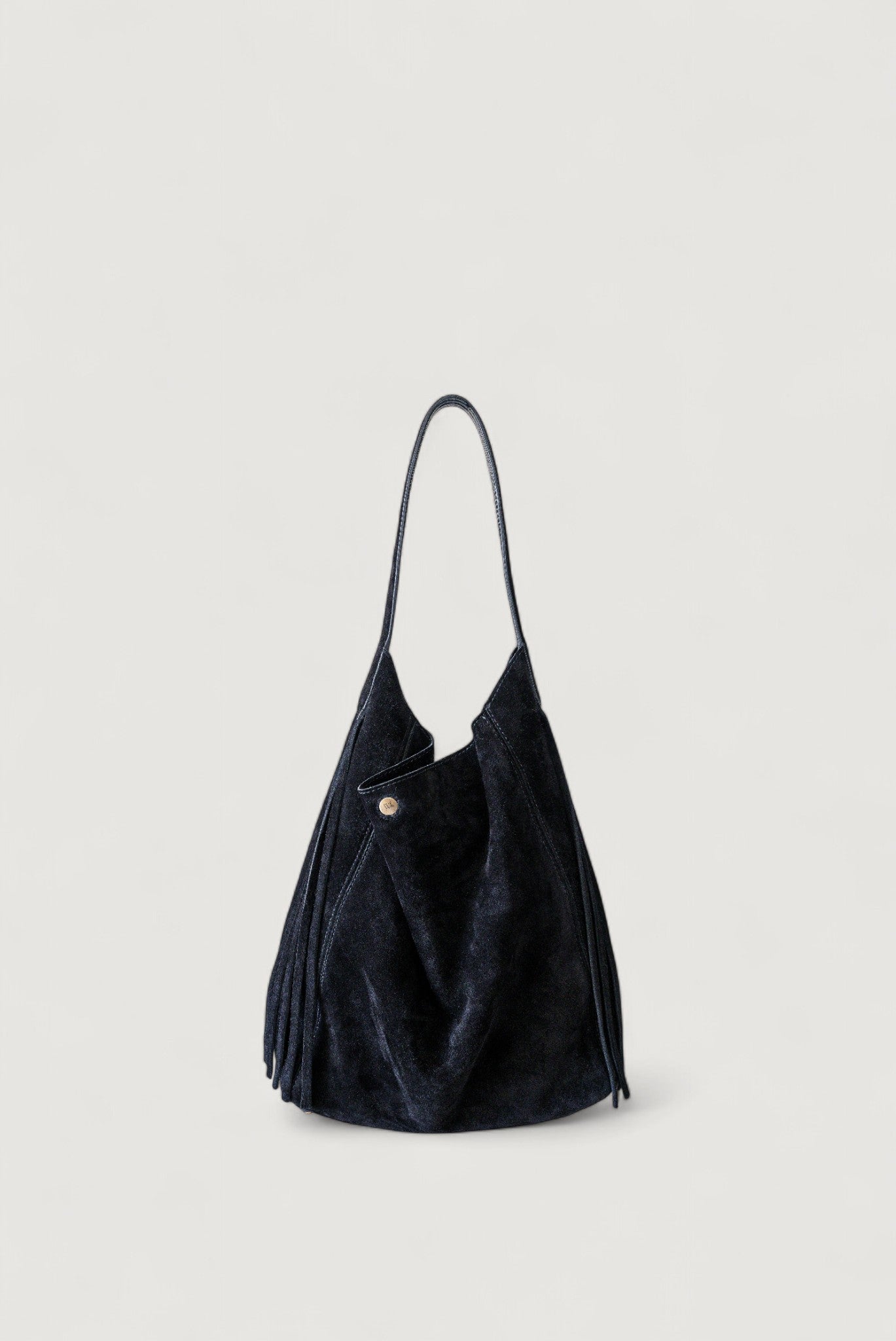 Black handbag with a strap on a light gray background