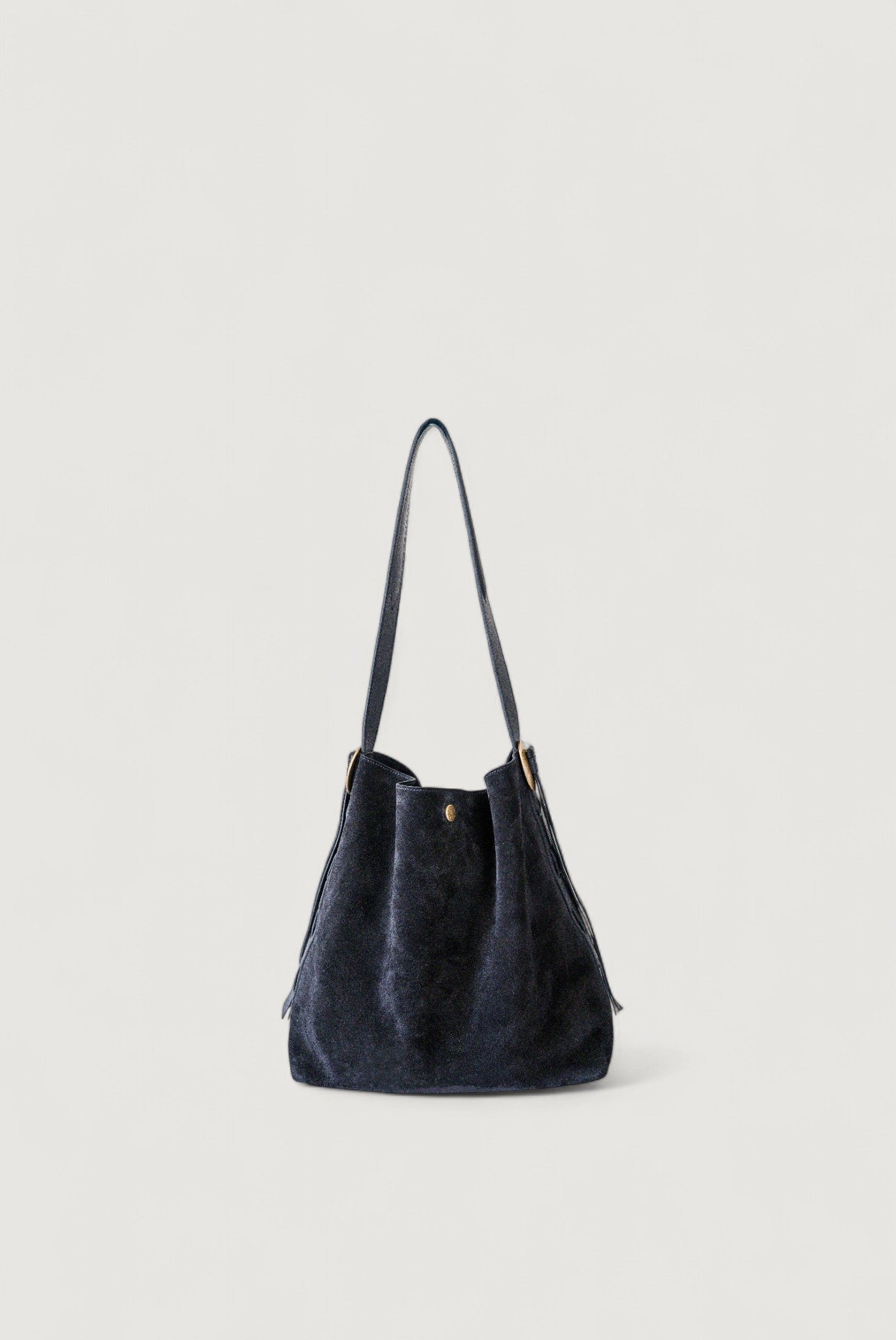 Black handbag on a light gray background
