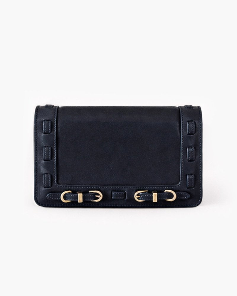 Black clutch bag with brass hardware on a white background
