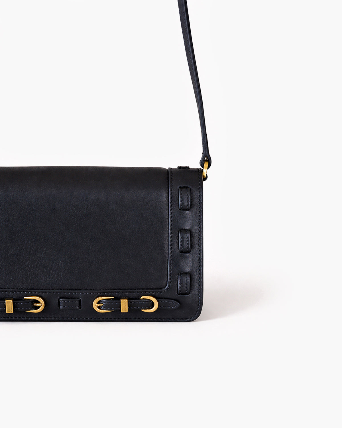 Black handbag with gold accents on a white background