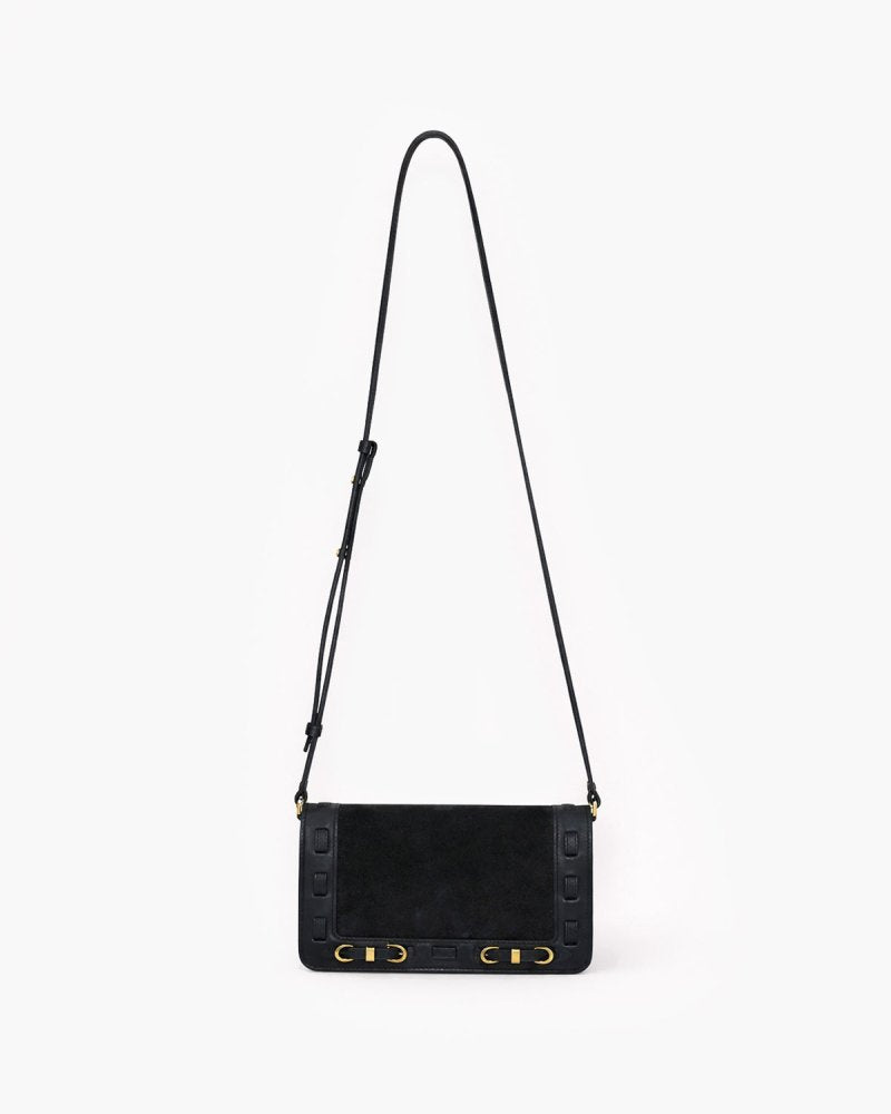 Black handbag with brass hardware on a white background
