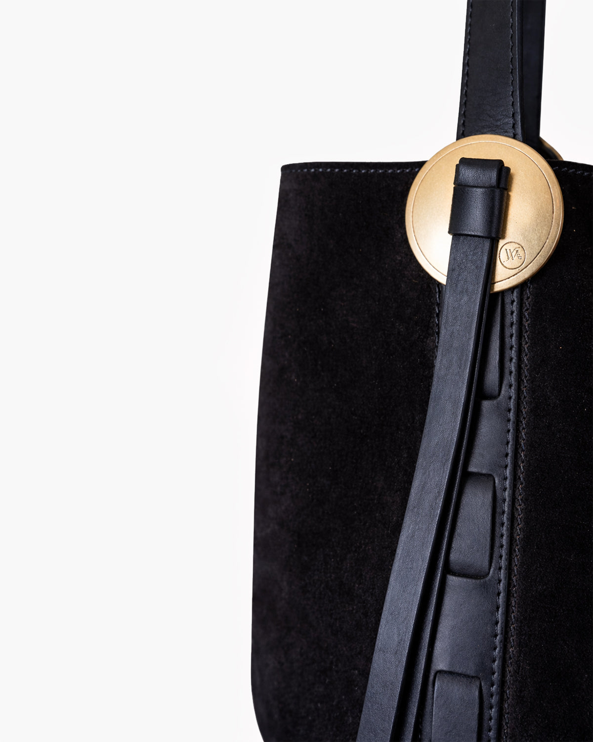 Black handbag with a gold clasp on a white background