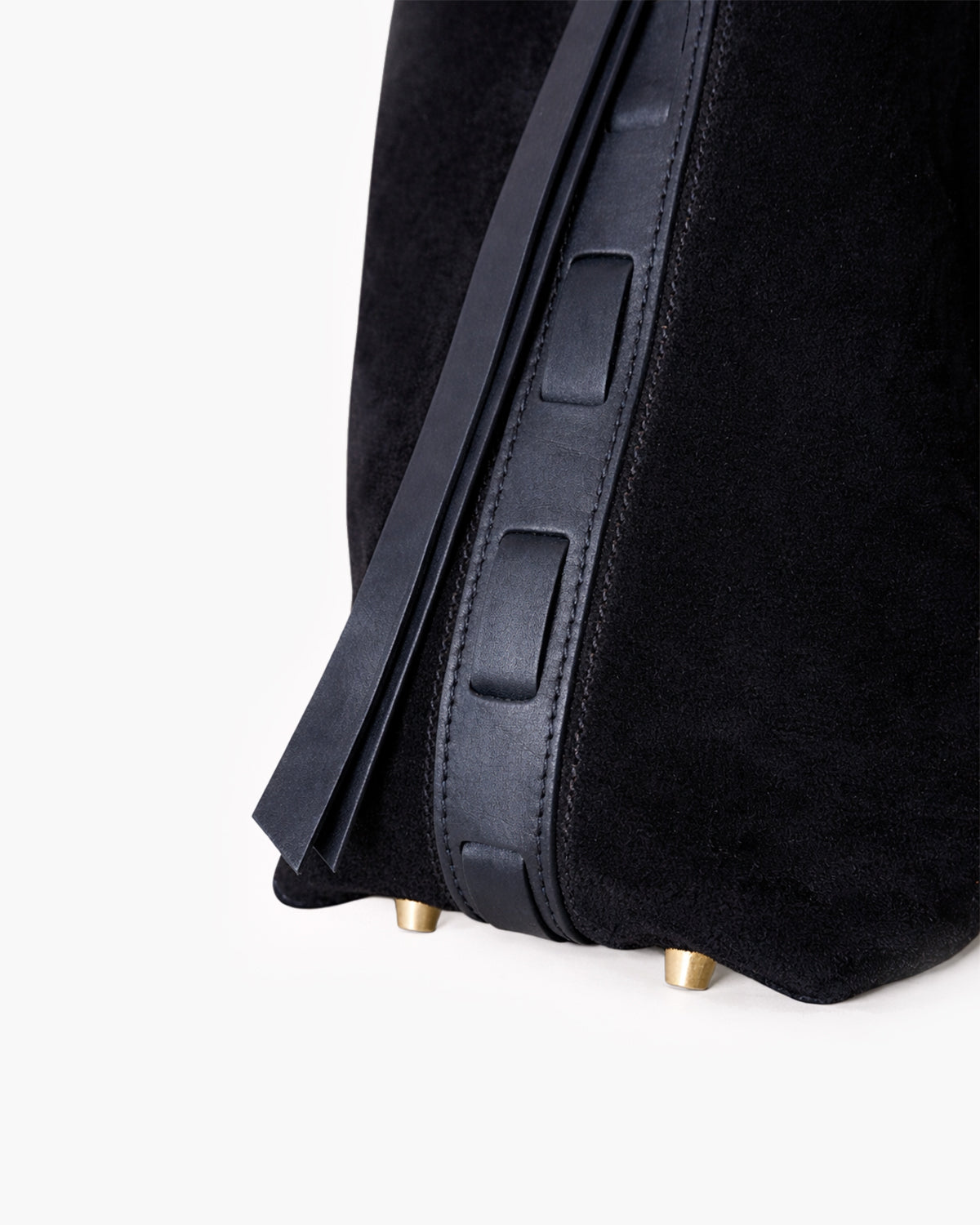 Black bag with gold studs on a white background