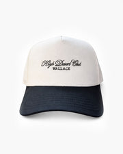 Two-tone cap with 'High Desert Club Wallace' text on a white background