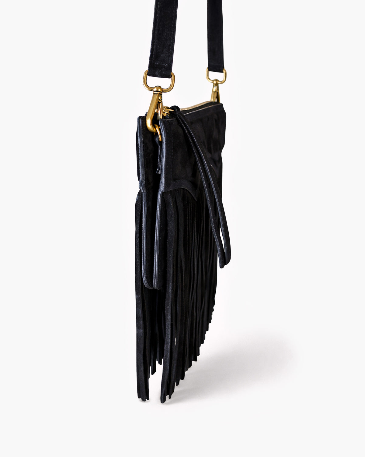 Black fringe handbag with gold hardware on a white background