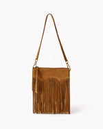 Brown suede handbag with fringe details on a white background