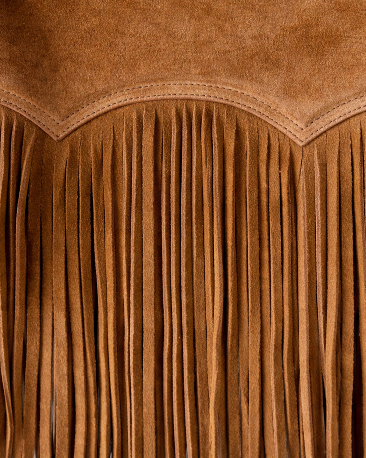 Close-up of brown suede fringe detail