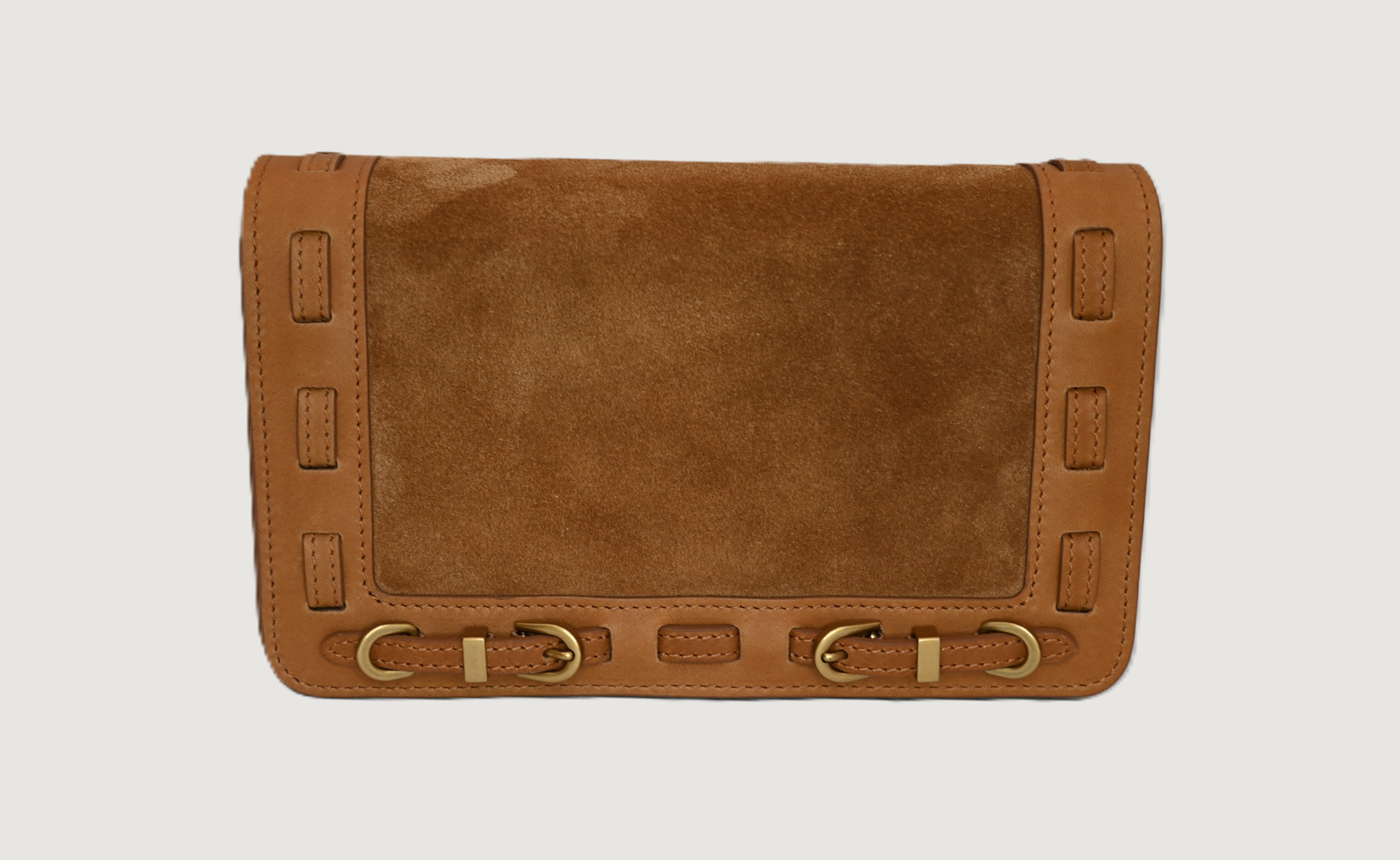 Cashew leather clutch bag with brass accents on a light gray background