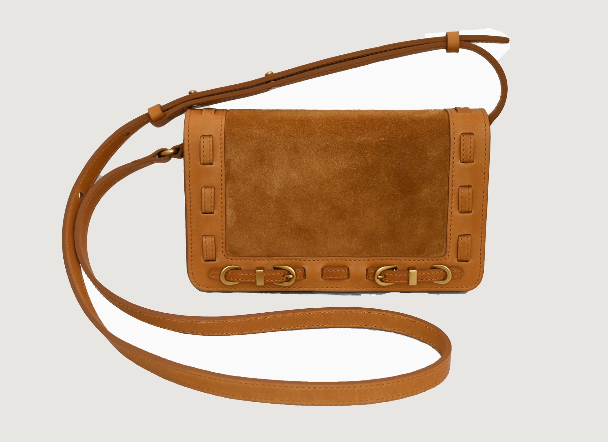Cashew leather crossbody bag on a light gray background